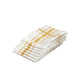 Stack of folded white tea towels with yellow stripes on a white background