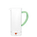 Clear glass pitcher with a green handle on a white background