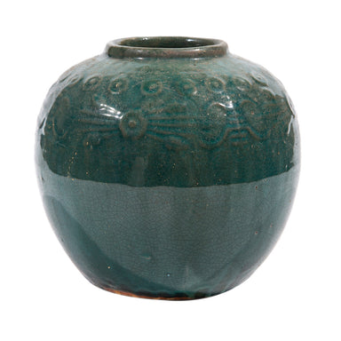 Green ceramic vase with decorative patterns on a white background