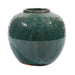 Green ceramic vase with decorative patterns on a white background