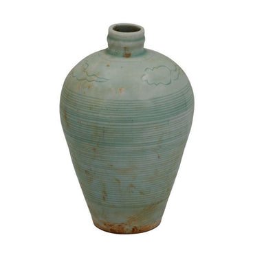 Vintage ceramic vase with textured surface on a white background