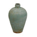 Vintage ceramic vase with textured surface on a white background