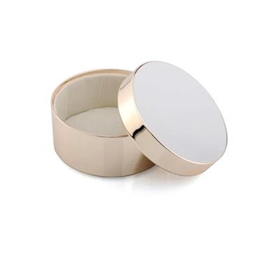 Round ceramic container with gold rim on a white background