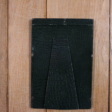 green leather back of vintage frame