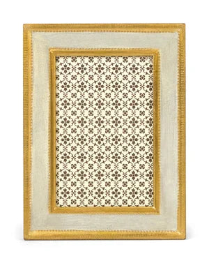 Decorative picture frame with a gold border and intricate patterned center on a white background