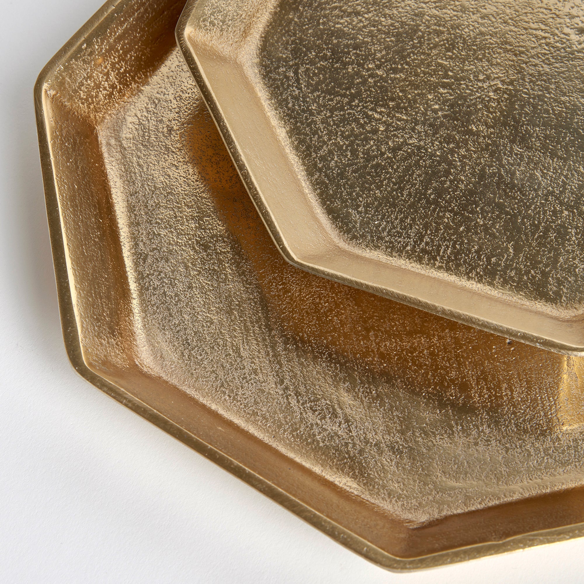 close up on gilded hex trays