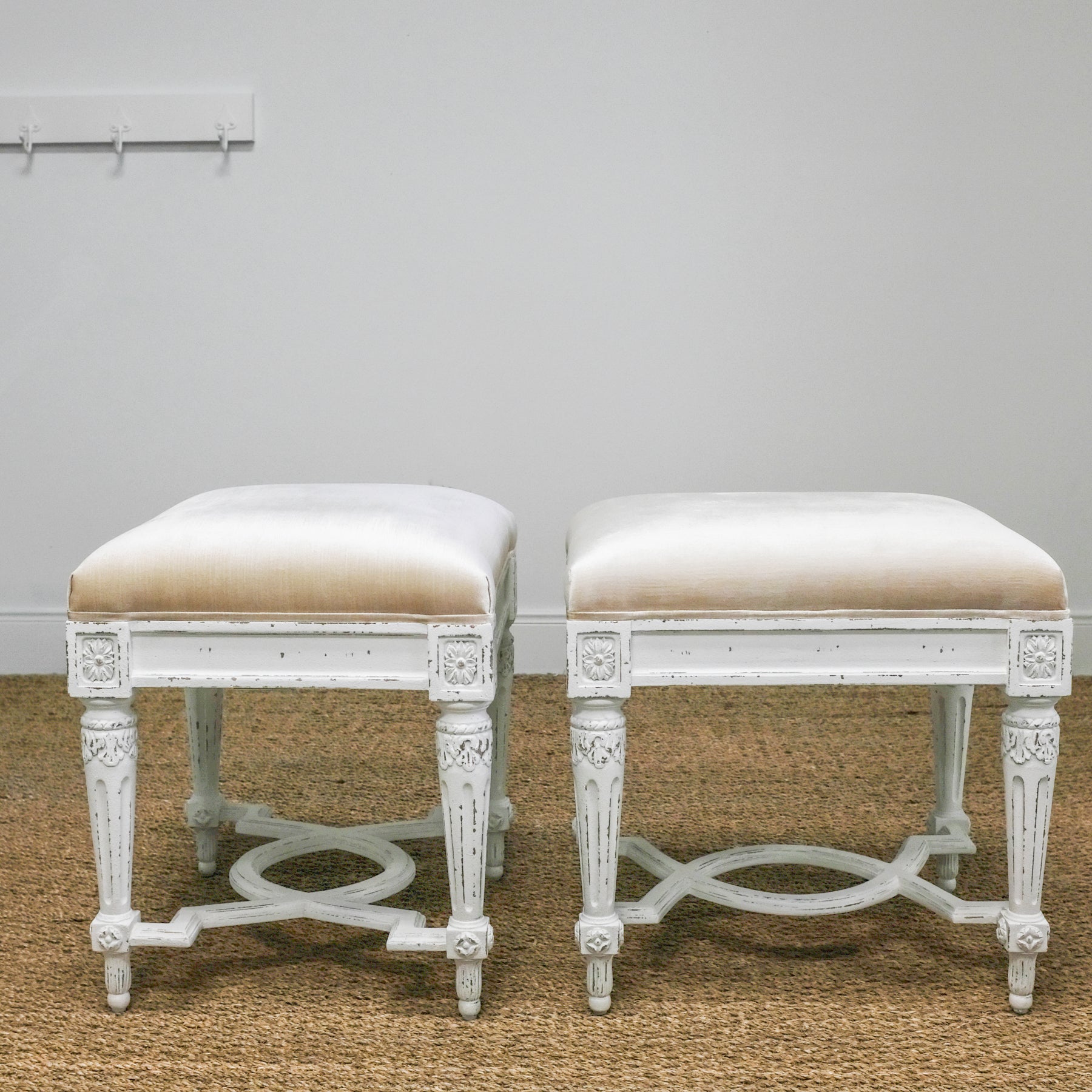 side view of two velvet stools