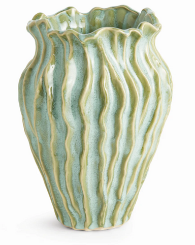 Decorative ceramic vase with wavy texture on a white background