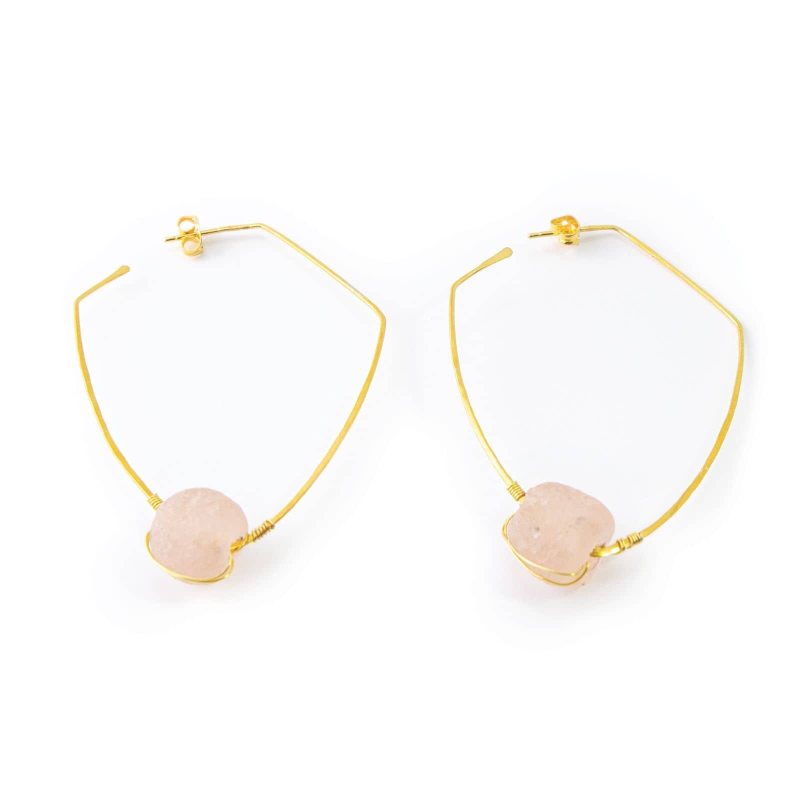 Gold hoop earrings with pink stones on a white background