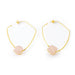 Gold hoop earrings with pink stones on a white background