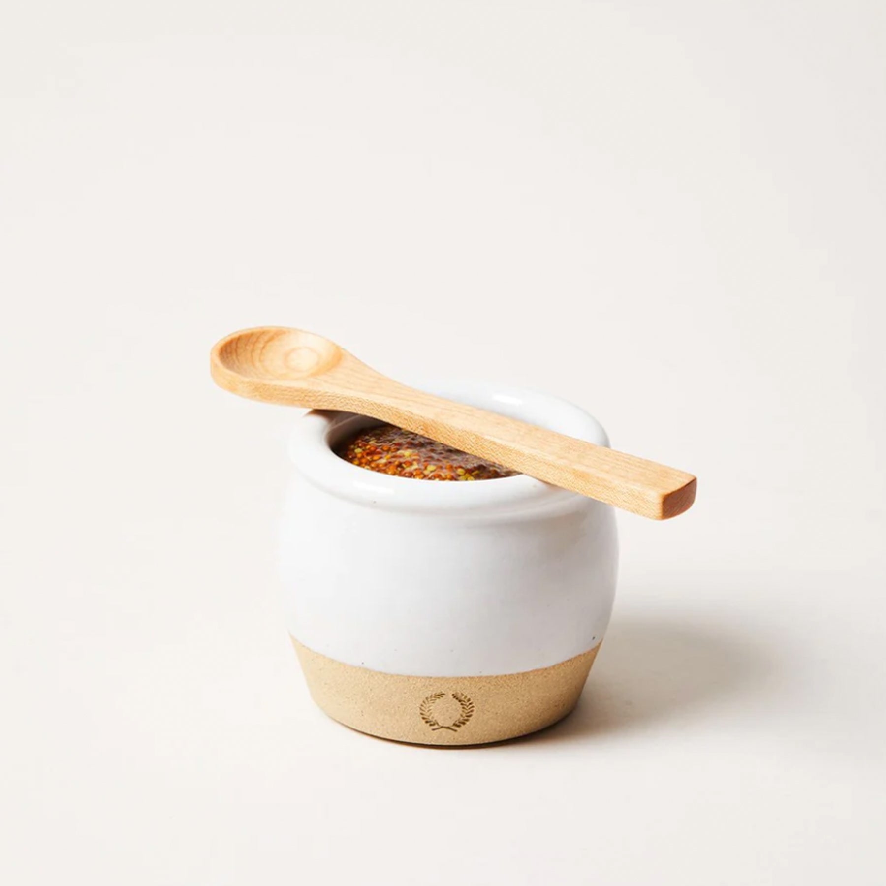 white glazed pickle pot with wood spoon