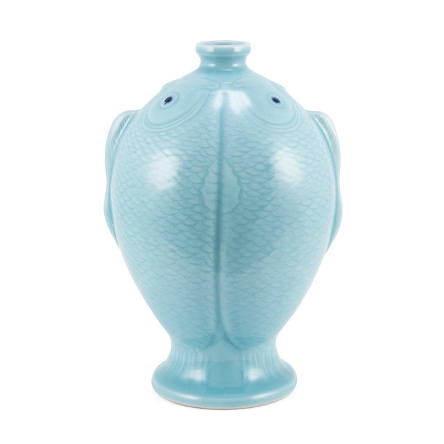 Light blue ceramic fish-shaped vase on a white background