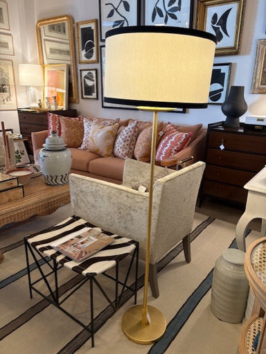 Living room with a lamp, sofa, and coffee table.