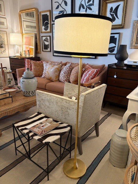 Living room with a lamp, sofa, and coffee table.