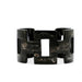 Black tortoiseshell bracelet on a white background