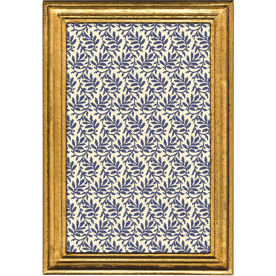 Framed patterned paper with blue leaf design on a white background
