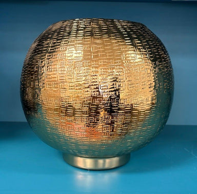 Gold textured spherical object on a blue background