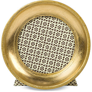 Decorative gold plate with intricate black pattern on a white background