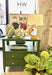 Green side table with decorative items in a room setting