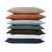 Stack of multicolored cushions on a white background