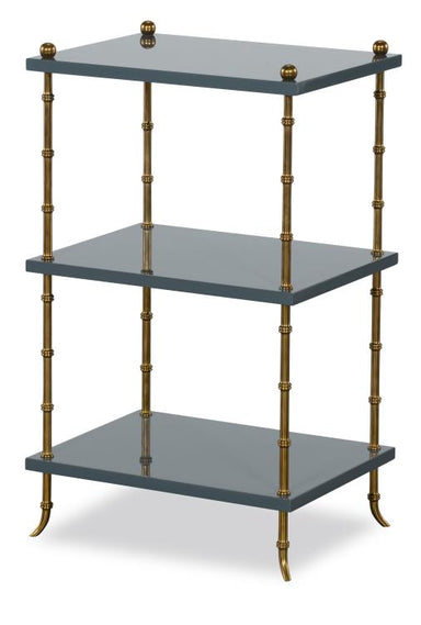 Three-tiered shelf with brass accents on a white background