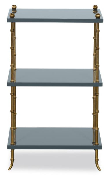 Three-tiered shelf with brass accents on a white background