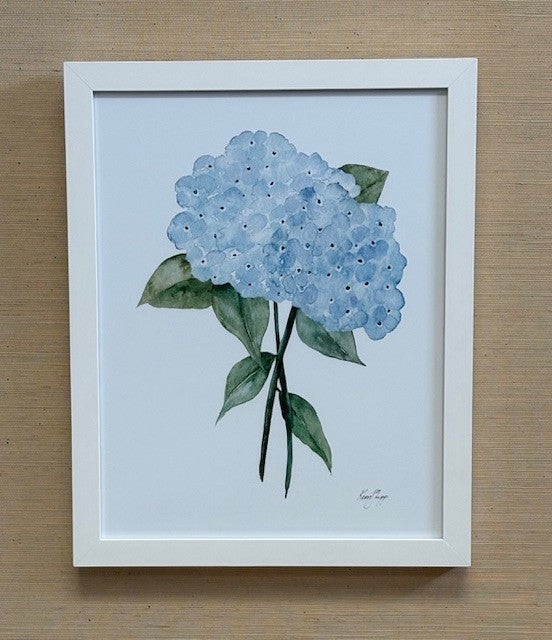 Framed artwork of a blue flower on a white background