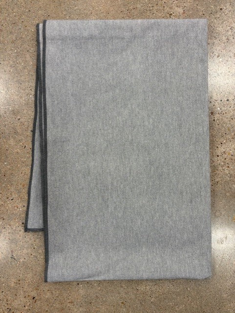 Gray blanket on a textured surface