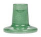 Green glass candleholder on a white background