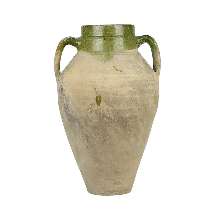 Vintage ceramic vase with green accents on a white background
