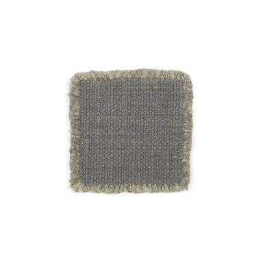 Textured square coaster with frayed edges on a white background