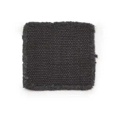 Dark gray woven coaster on a white background