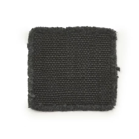 Dark gray woven coaster on a white background