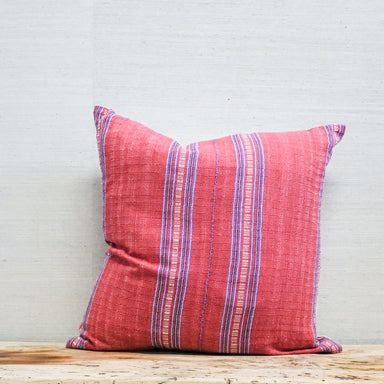 square pillow with red and blue stripe textile