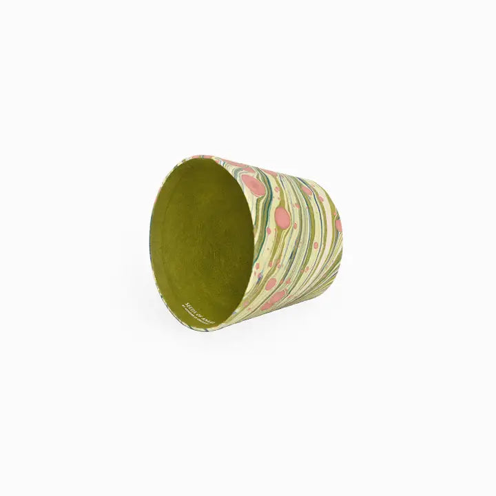 Marbled paper lampshade with green interior on a white background