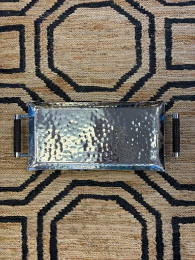 Metallic tray on a patterned rug