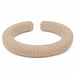 Beige textured bracelet on a white background