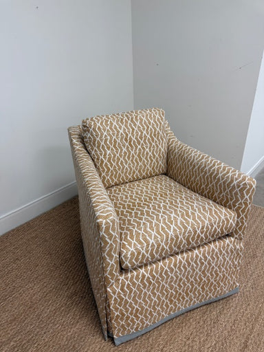 Geometric armchair on a carpeted floor