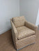 Geometric armchair on a carpeted floor