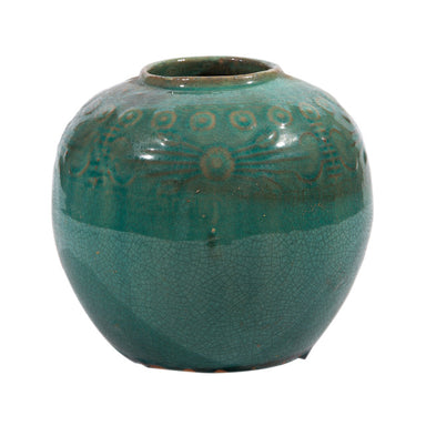 Green ceramic vase with textured design on a white background