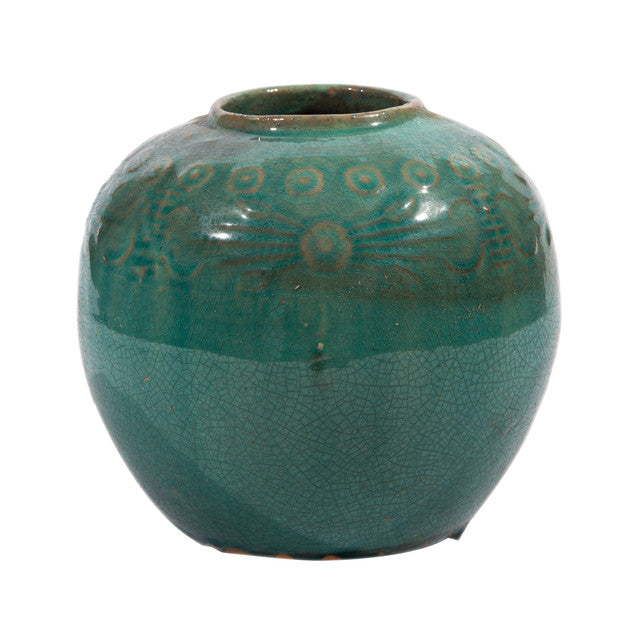 Green ceramic vase with textured design on a white background