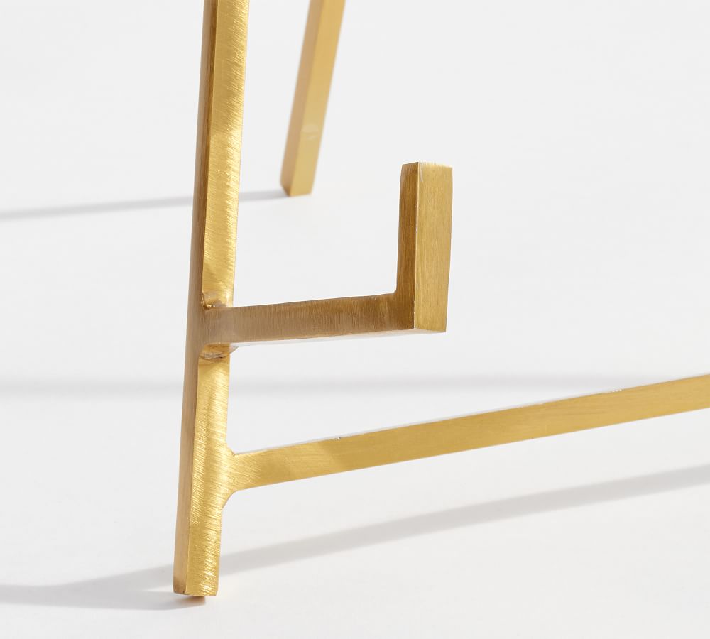Gold metal stand on a white background
