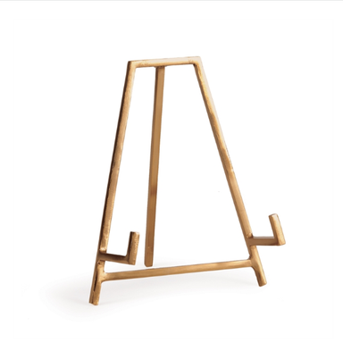 Gold metal easel on a white background