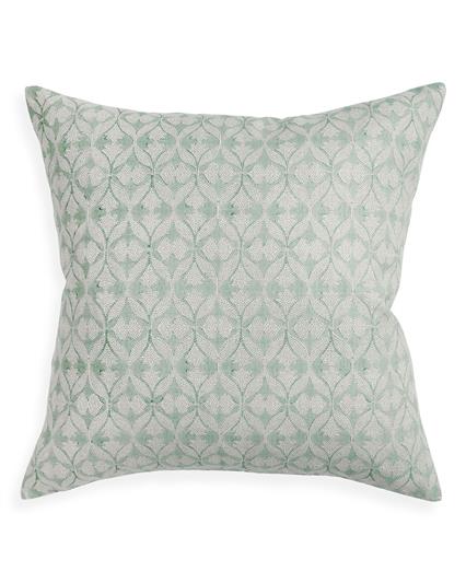 Decorative pillow with a subtle pattern on a white background