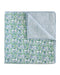 Folded quilt with green and blue pattern on a white background