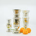 trio of mercury glass vases with orange ranunculuses