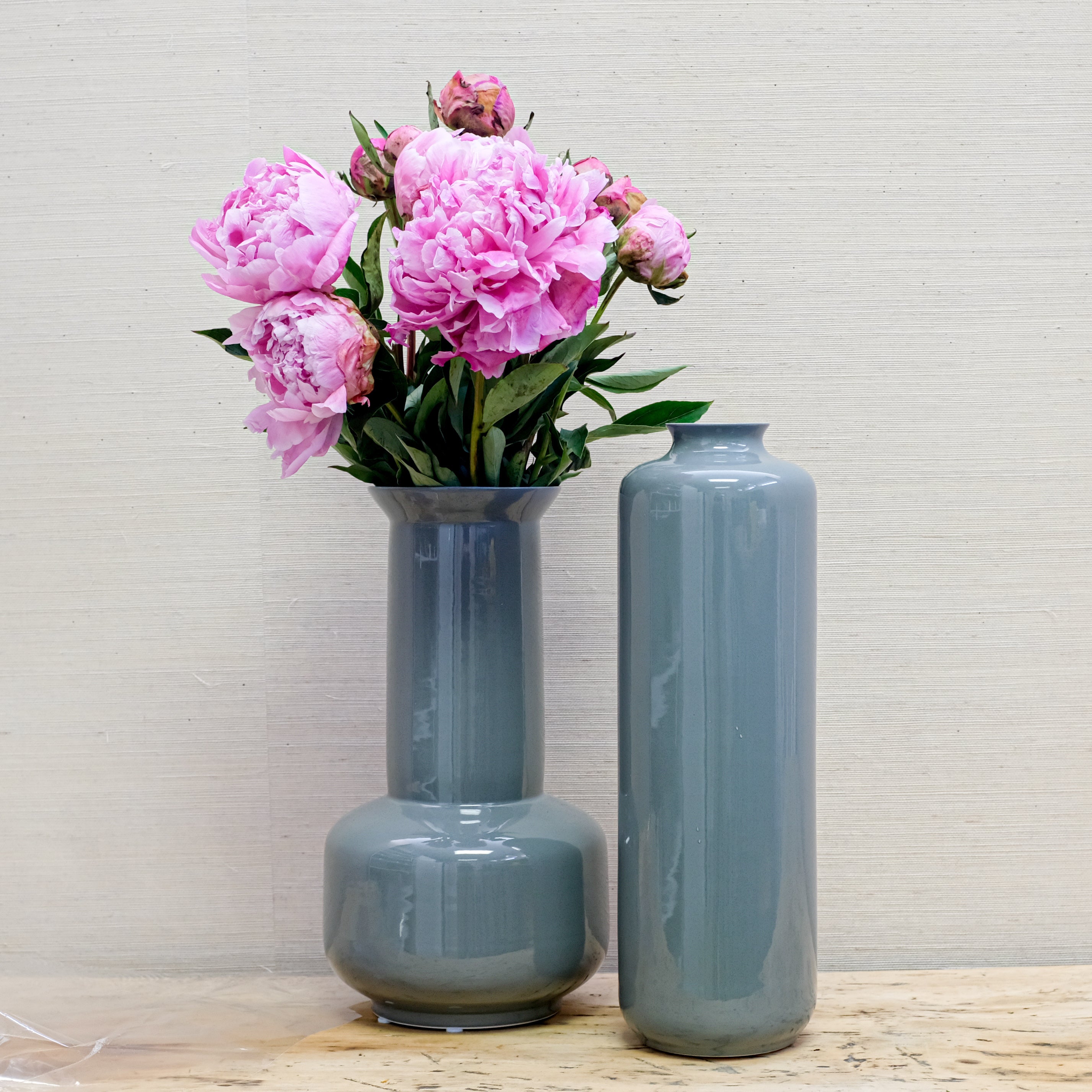 pair of glossy grey vases with peonies