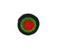 Round woven object with concentric green and red circles on a white background