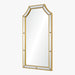 Wall mirror with gold frame on a white background