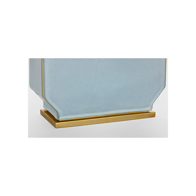 Decorative planter with gold base on a white background